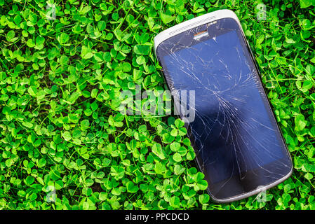 Broken screen of the cellphone or smartphone. Black cracked Touch Screen Phone Stock Photo