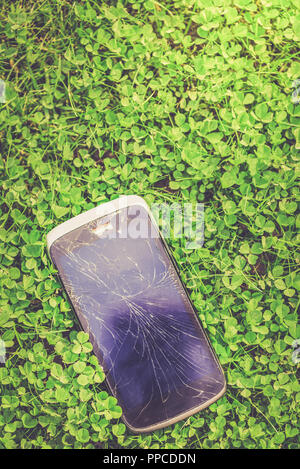 Broken screen of the cellphone or smartphone. Black cracked Touch Screen Phone Stock Photo