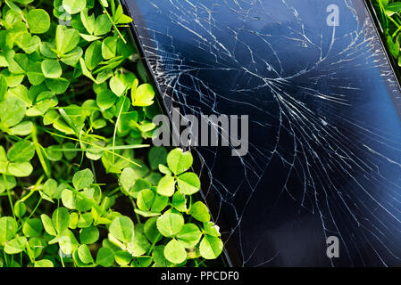Broken screen of the cellphone or smartphone. Black cracked Touch Screen Phone Stock Photo