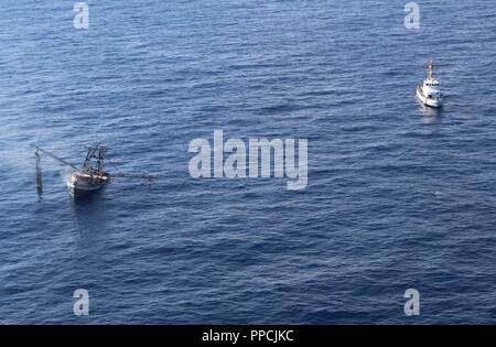 U.S. Coast Guard Cutter Coho provides mission support during the ...
