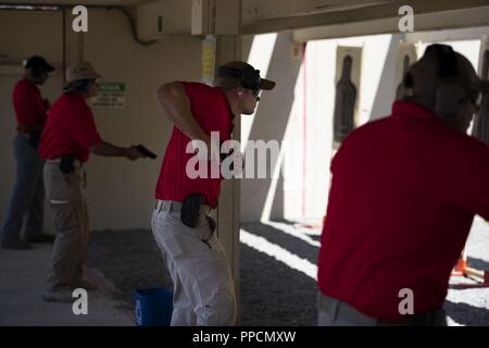 U.S. Army Reserve Criminal Investigation Command (CID) special agents, qualify on their assigned weapons during Guardian Shield, Aug. 27, 2018 in Coronado, California. Guardian Shield 2018 is an Army Reserve CID-led training exercise that certifies Army Reserve special agents on courses they need to progress in their career, as well as provides training to active duty Army CID, Naval Criminal Investigative Service (NCIS) agents, Marine Corps CID, civilian law enforcement and Navy and Marine EOD. In its ninth year, Guardian Shield continues to be one of the most in-depth training events for mil Stock Photo