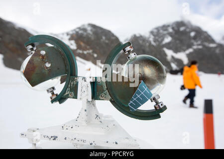 A Campbell Stokes Sunshine Recorder, which measures hours of sunlight at Base Orcadas, which is an Argentine scientific station in Antarctica, and the oldest of the stations in Antarctica still in operation. It is located on Laurie Island, one of the South Orkney Islands, just off the Antarctic Peninsula. The Antarctic Peninsula is one of the fastest warming places on the planet. Stock Photo