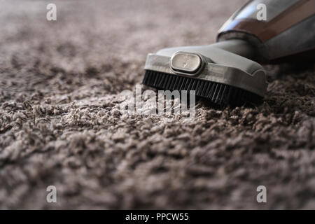Close-up Of man  using A Vacuum Cleaner professional vacuum cleaner Stock Photo