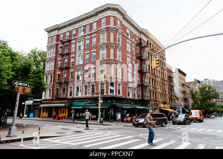 New York City, USA - June 22, 2018: People crossing Carmine Street in Greenwich Village. It is one of the most trendy districts of New York Stock Photo
