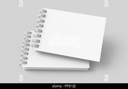 White hard cover notebooks in 3d rendering on light grey background, elevated view Stock Photo