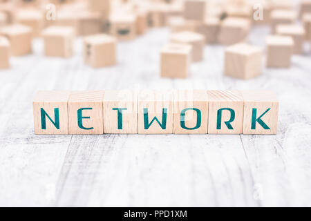 The Word Network Formed By Wooden Blocks On A White Table Stock Photo
