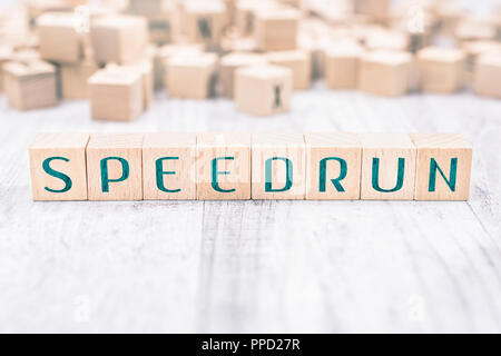 The Word Speedrun Formed By Wooden Blocks On A White Table Stock Photo