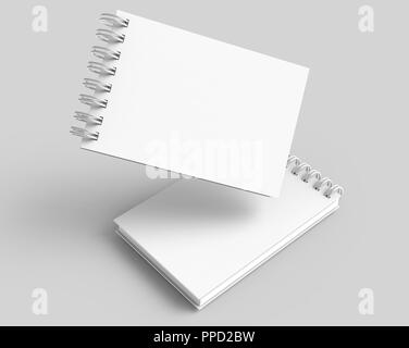 Spiral notebooks blank template in 3d rendering on light grey background, elevated view Stock Photo