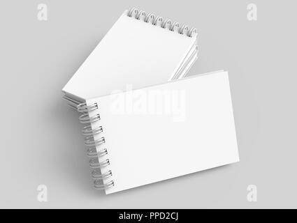 Spiral notebooks blank template in 3d rendering on light grey background, elevated view Stock Photo