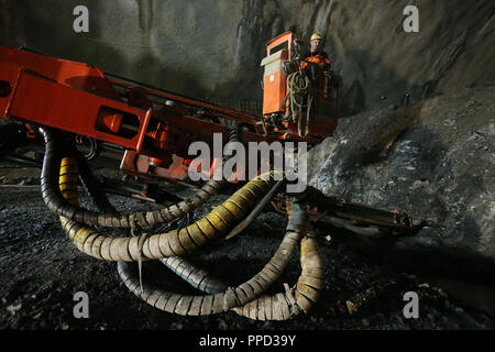 Construction work at the Oberau Tunnel. Starting 2022 the Oberau bypass will be able to accommodate the traffic of the Garmischer Autobahn. In the picture a tunneling machine sets holes for the explosive. Stock Photo
