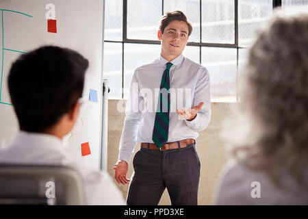Young white businessman giving a presentation, close up Stock Photo