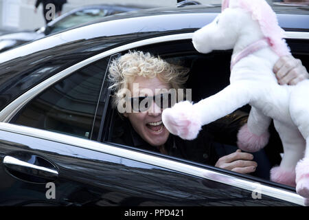 The members of the rock band "Scorpions" visit the guitar store "MJ Guitars" of Matthias Jabs at the Pariser Strasse in Haidhausen before their Munich concert. In the picture drummer James Kottak with a Jessie James plush toy. Stock Photo