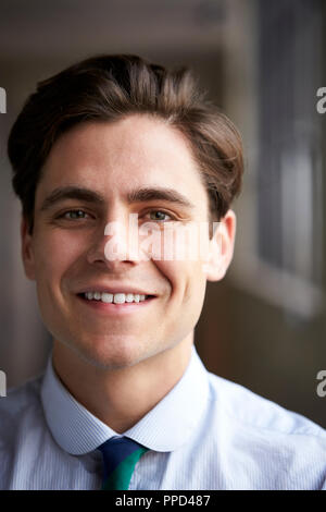 Close up head and shoulders of young white businessman Stock Photo
