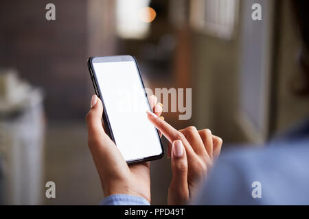 Close up of woman’s hands using smartphone touchscreen Stock Photo