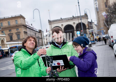 A team of scientists from the University of Heidelberg and activists of the environmental organization Greenpeace measures the pollution of air with nitrogen dioxide (NO2) at the Odeonsplatz in Munich. With these measurements, Greenpeace wants to increase the pressure on the city and the free state to take effective measures for air pollution. Stock Photo