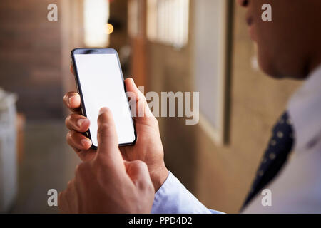 Close up of mixed race man using smartphone Stock Photo