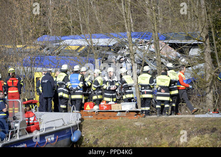 After the frontal collision of two meridian trains at Bad Aibling, rescue workers from the fire brigade, the police, the Bergwacht (mountain rescue service), Wasserwacht (water rescue service), the Red Cross and the Technisches Hilfswerk at the scene of the accident, trying to rescue the injured and salvage the bodies of those killed. Stock Photo