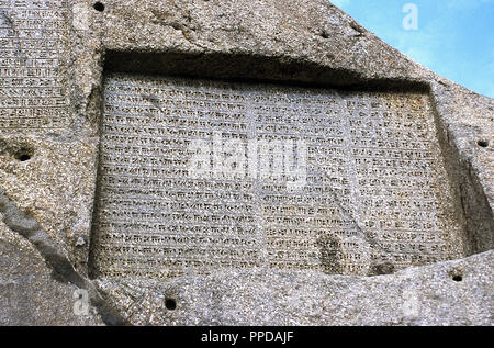 Achaemenid Empire. Ganjnameh. Ancient inscription carved in granite in 3 languages: Old Persian, Neo-Babylonian and Neo-Elamite, written by order of the sovereigns Darius the Great (521-485 BC) and Xerxes the Great (485-65 BC). Cuneiform alphabets. Near Hamedan, Islamic Republic of Iran. Stock Photo