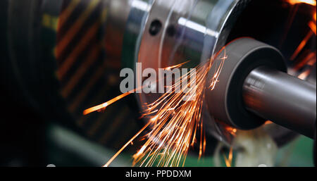 Finishing metal working on high precision grinding machine in workshop Stock Photo