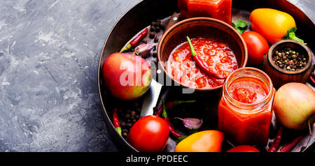 Georgian homemade sauce adjika with pepper, garlic and tomatoes Stock Photo