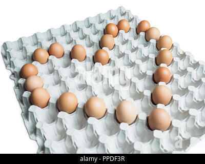 A tray or crate of brown chicken eggs. The eggs are placed in the shape of a heart to represent a healthy diet and a healthy heart Stock Photo