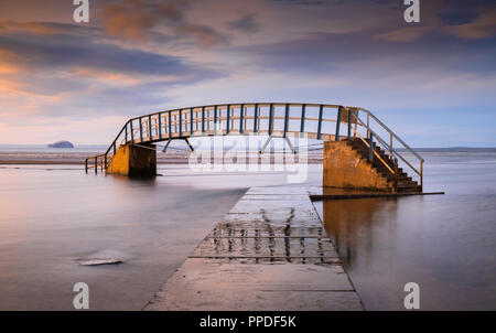 Belhaven bridge at low tide, often referred to as the Bridge To Nowhere, part of the John Muir Country Park, Dunbar, Scotland UK Stock Photo