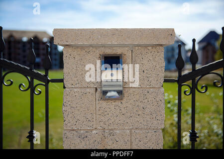 solar lamp on fence with sensor Stock Photo