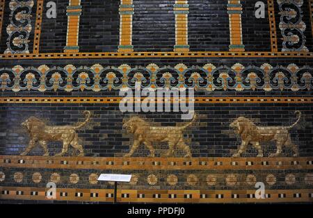 Mesopotamian art. Neo-Babylonian. The Throne Room of  Nebuchadnezzar II. Reconstructed facade. Dated in 580 B.C. Its 56 meters facade was decorated with colored glazed bricks as shows the composition, including stylized palms. The frieze of lions was presumably arranged symmetrically so that the animals faced toward the central main entrance to the trone-room. Detail. Pergamon Museum. Berlin. Germany. Stock Photo