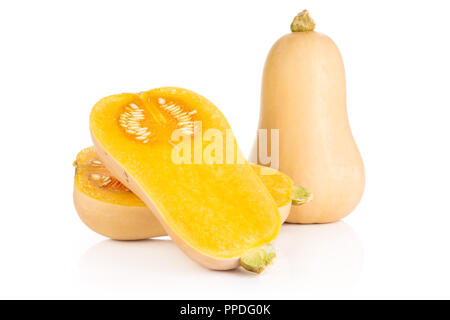 Group of one whole two halves of smooth pear shaped orange butternut squash waltham variety with seeds isolated on white background Stock Photo