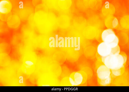 Abstact vibrant golden, yellow, orange circle bokeh background texture Stock Photo