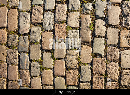 Top close up view of an old cobblestone street, background. Stock Photo