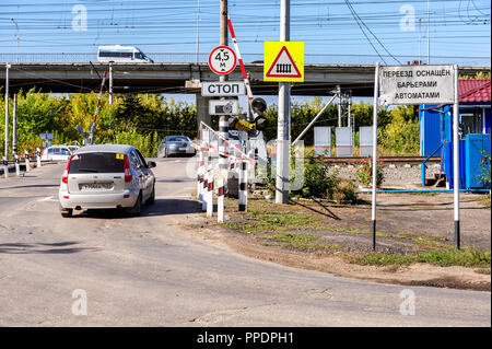 Samara, Russia - September 23, 2018: Traffic light and road sign on the railway crossing Stock Photo