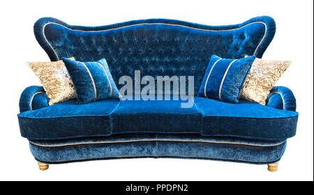 Blue velours sofa with pillows. Soft luxury classical couch with cushions isolated background. Stock Photo
