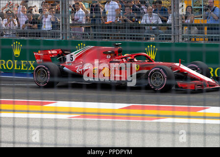 A Ferrari Formula One Racing Car at the Pit Exit of the Marina Bay Street Circuit in Singapore 2018 Stock Photo