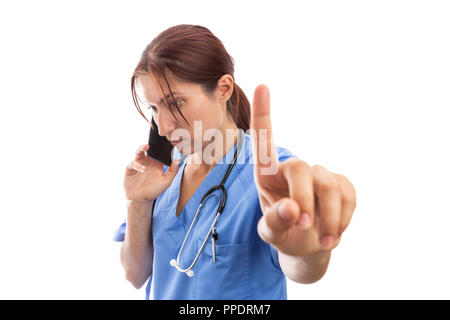 Busy nurse female talking on the phone and holding index finger up as hold stay wait gesture isolated on white Stock Photo
