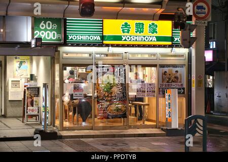 KYOTO, JAPAN - NOVEMBER 27, 2016: People visit Yoshinoya restaurant in Kyoto, Japan. Yoshinoya is the largest chain of gyudon restaurants (beef bowl). Stock Photo