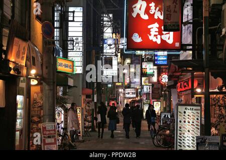 OSAKA, JAPAN - NOVEMBER 22, 2016: People visit restaurants along shopping street in Umeda district, Osaka. Osaka belongs to 2nd largest metropolitan a Stock Photo