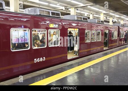 OSAKA, JAPAN - NOVEMBER 22, 2016: Passengers hurry at Hankyu Umeda Station in Osaka, Japan. Hankyu Railway station was opened in 1910. Stock Photo