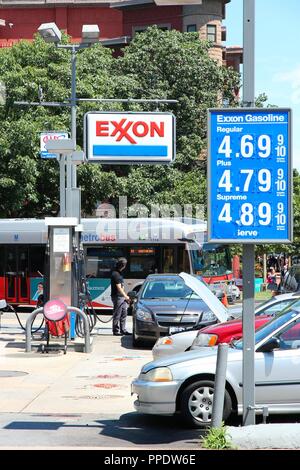 WASHINGTON, USA - JUNE 14, 2013: People visit Exxon gas station in Washington, DC, USA. ExxonMobil is the 3rd largest company in the world by revenue  Stock Photo