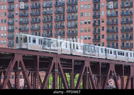 CHICAGO, USA - JUNE 28, 2013: People ride Chicago's elevated train. L train system served 231 million rides in 2012. Stock Photo