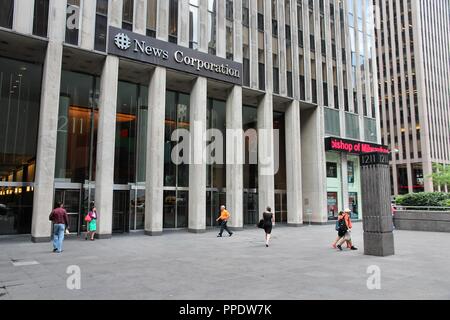 NEW YORK, USA - JULY 2, 2013: People walk past News Corporation at 6th Avenue in New York. Famous News Corporation was divided into News Corp and 21st Stock Photo