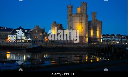 Caernarfon Castle, and The Anglesey Pub, on the River Seiont, Caernarfon, Gwynedd, North Wales. Image taken in September 2018. Stock Photo