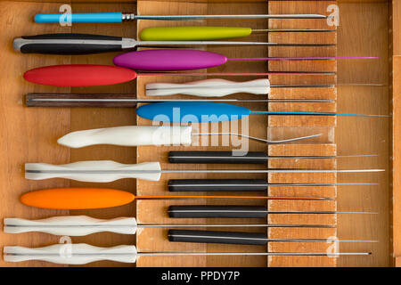 Fitted knife drawer in a wooden kitchen cabinet with a neat array of knives  with assorted cooking utensils in a full frame overhead view Stock Photo -  Alamy