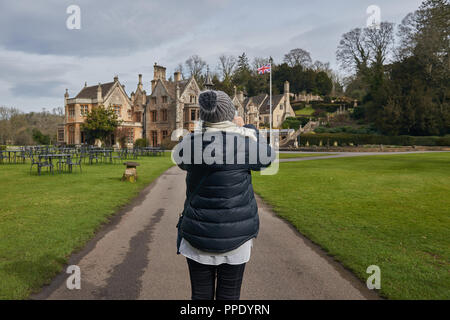 Female tourist taking pictures of famous place in England in winter time