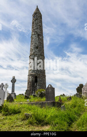 The round tower near the ruins of Ardmore Cathedral, County Waterford in the Republic of Ireland. Stock Photo