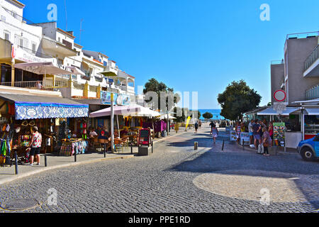 Olhus d'Agua is located on the Algarve coast of southern Portugal. Restaurants shops and bars are located on the road down to the beach Stock Photo