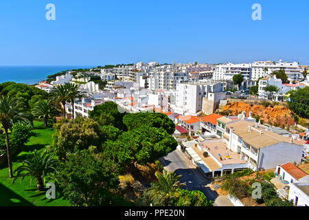 Olhus d'Agua is located on the Algarve coast of southern Portugal. This view is of the main road through the village down to the beach Stock Photo