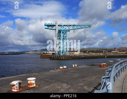 The mighty Titan crane, which was once part of the famous John Brown shipbuilding yard in Clydebank on the River Clyde, has now been renovated and now welcomes tourists to come along and take the lift to the jib and walk along admiring the wonderful views from there, In Glasgow. Stock Photo