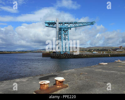 The mighty Titan crane, which was once part of the famous John Brown shipbuilding yard in Clydebank on the River Clyde, has now been renovated and now welcomes tourists to come along and take the lift to the jib and walk along admiring the wonderful views from there, In Glasgow. Stock Photo