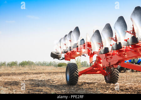 Agricultural plow close-up on the ground, farm equipment Stock Photo